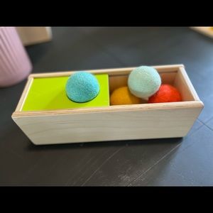 Lovevery “sliding top box” sliding felt ball drop box